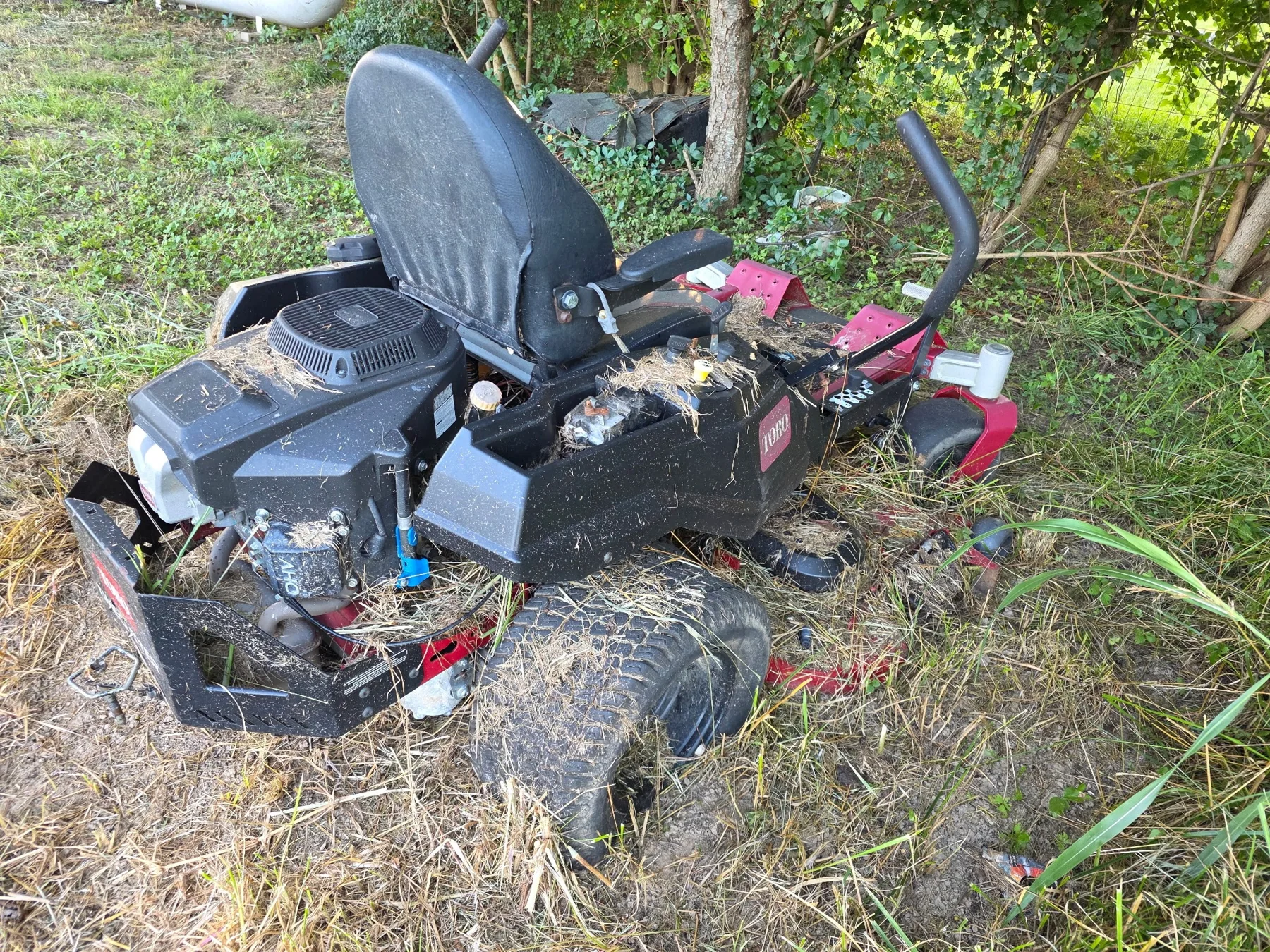 Mower sitting outdoors before pickup