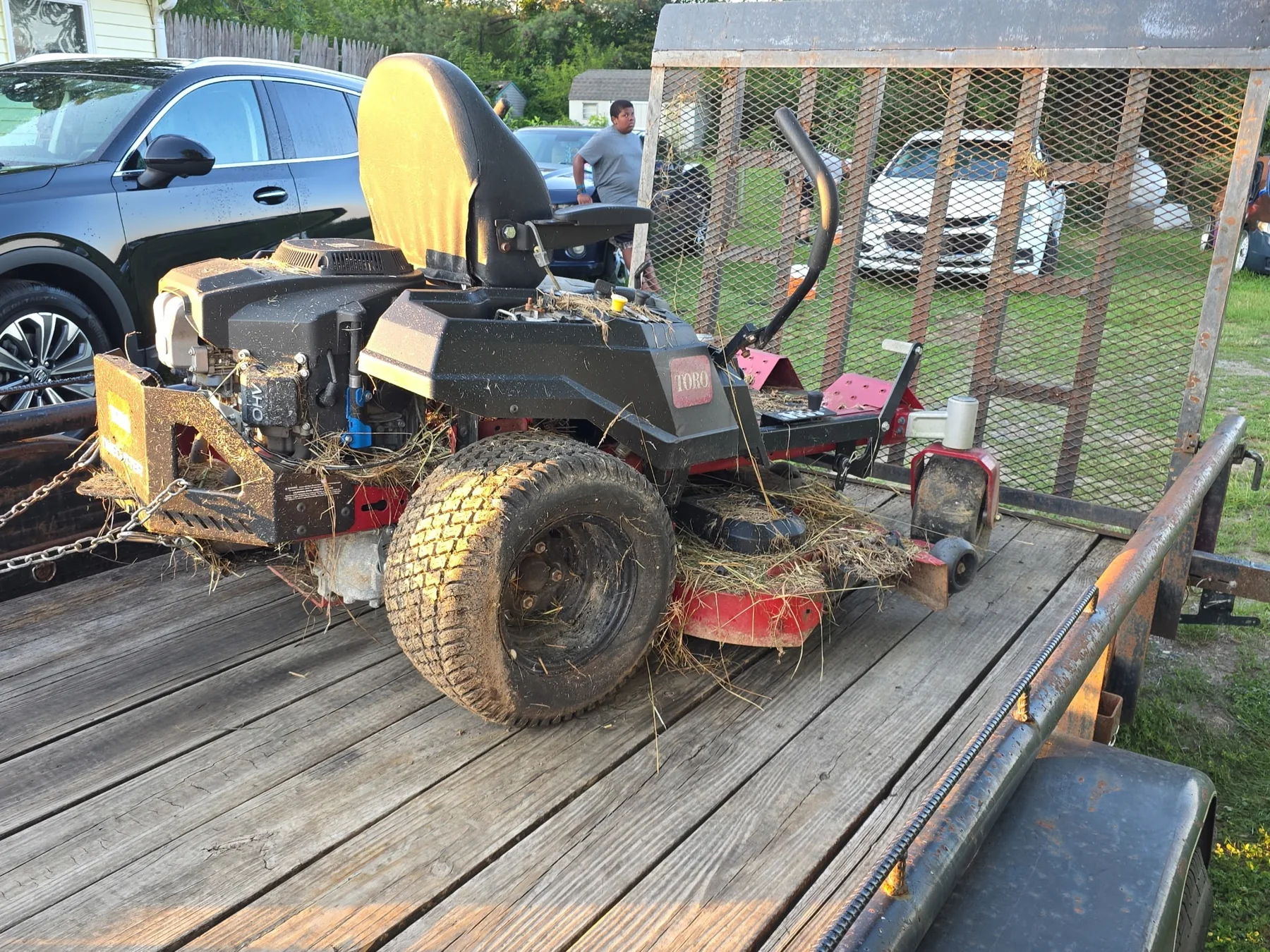 Mower loaded onto trailer for pickup